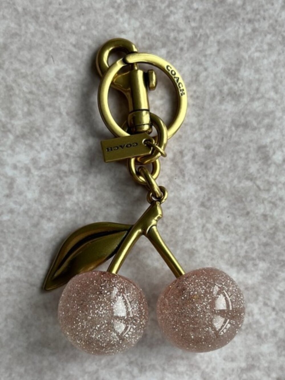 COACH Pink Glitter Cherry Bag Charm with Gold Hardware